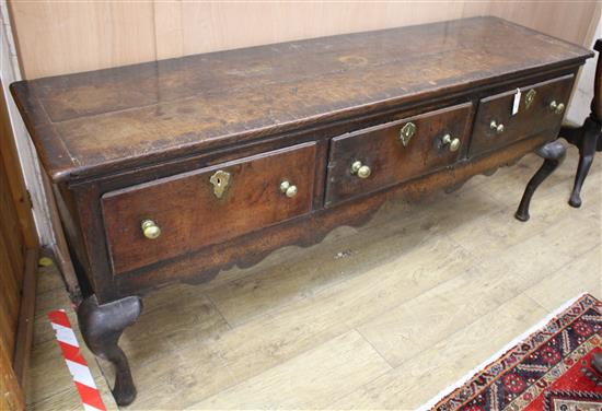 A George III banded oak low dresser, W.188cm D.51cm H.77cm